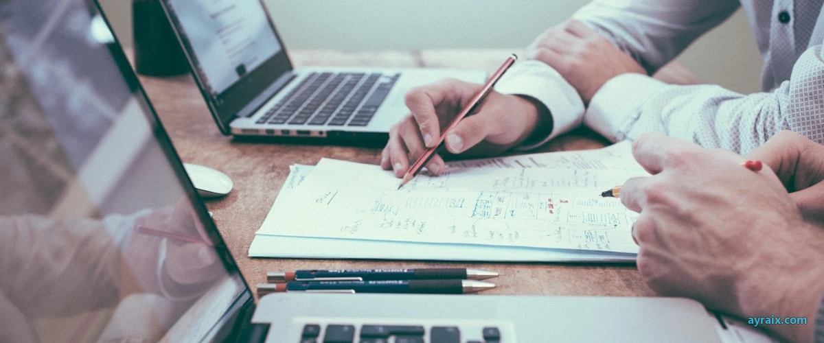 Desk with tickets and planning docs — ayraix.com regression suite built from real work