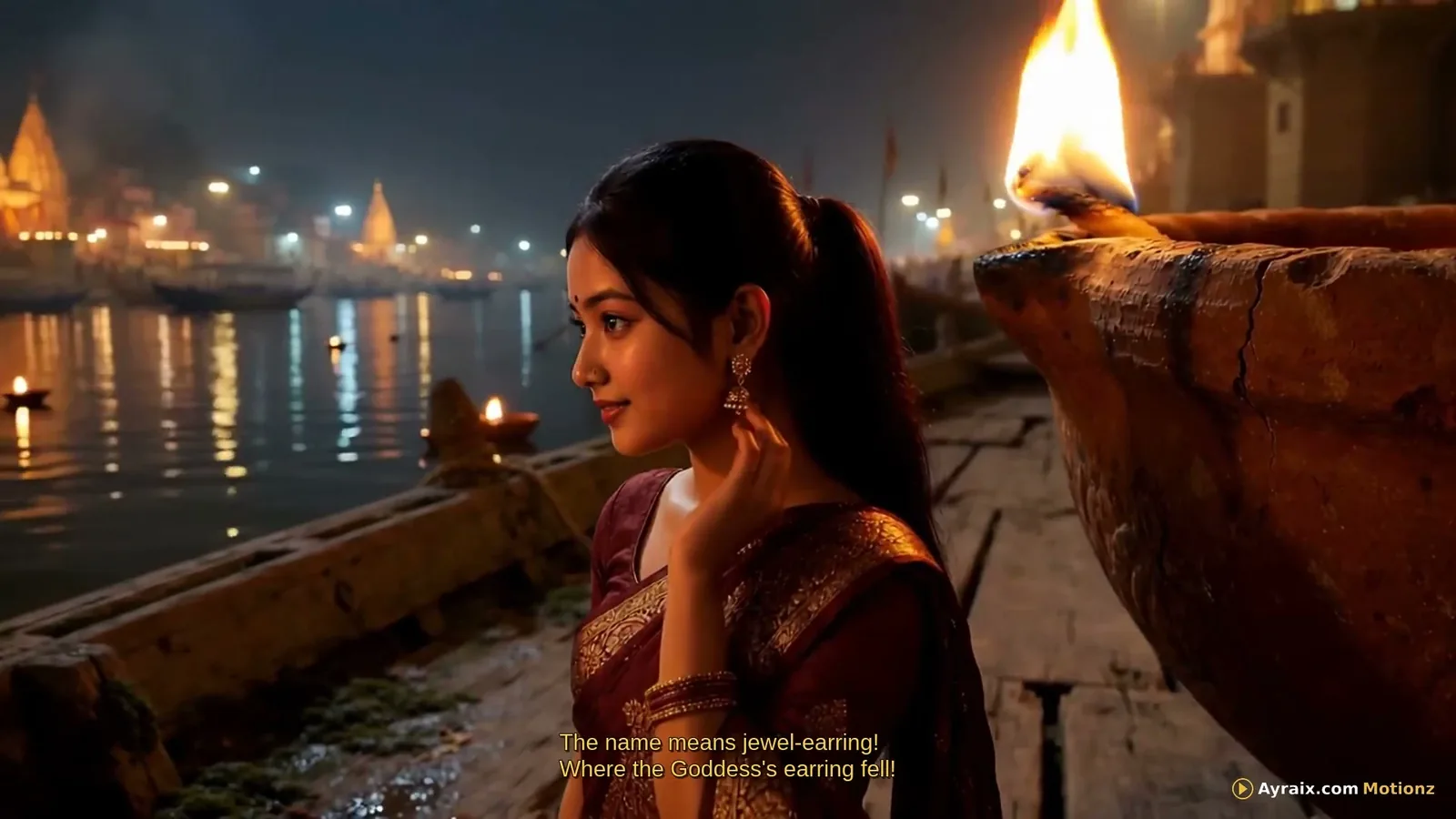 Tiny Zara standing respectfully at dusk beside a large clay flame on the Varanasi riverfront